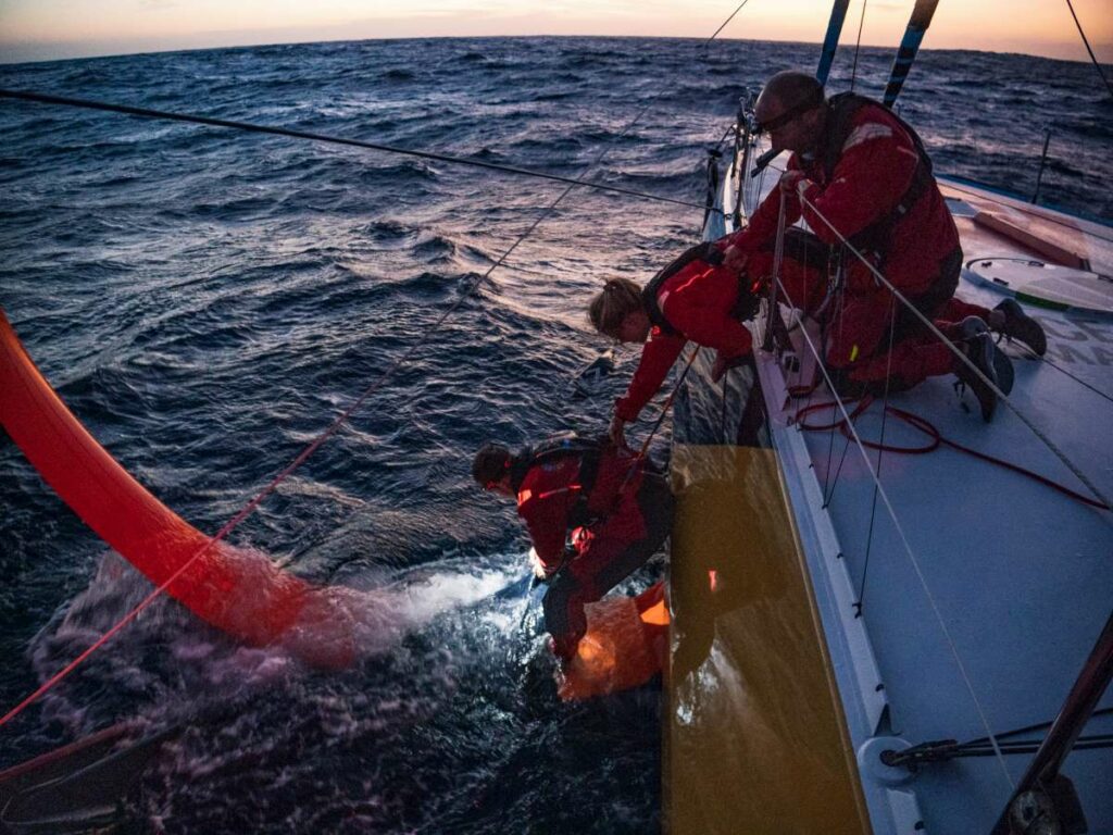 The Ocean Race 2022-23 - 28 February 2023, Leg 3, day 2 onboard Team Malizia. Boris Herrmann, Rosalin Kuiper, Nicolas Lunven recovering the downwind sail.
© Antoine Auriol / Team Malizia