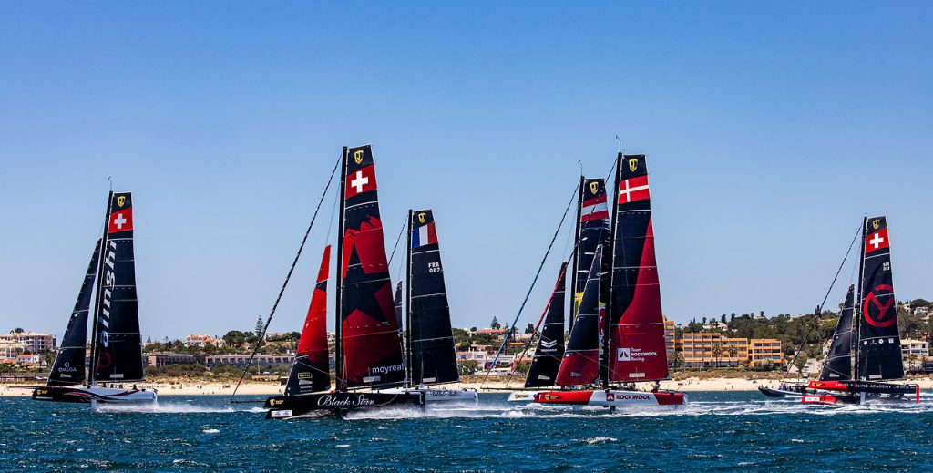 Team Alinghi lead the fleet upwind 