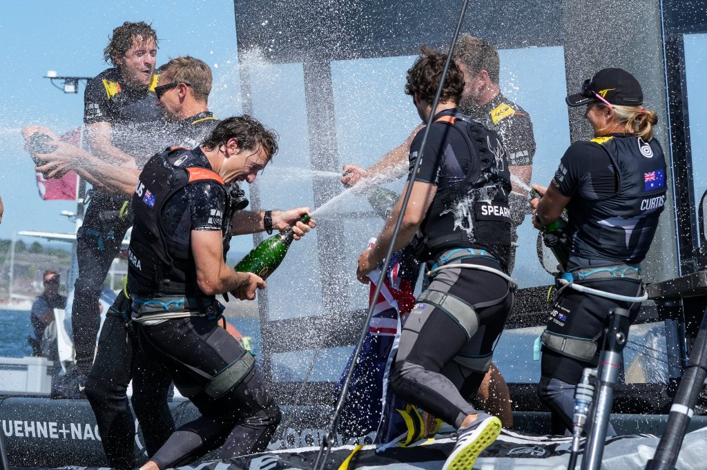 Australia SailGP Team helmed by Tom Slingsby celebrate winning Great Britain SailGP with Champagne Barons de Rothschild, Event 3, Season 2 in Plymouth, UK. 18 July 2021.