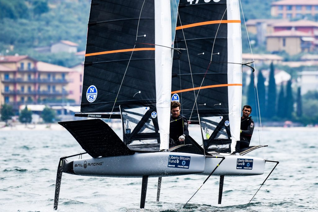 Tom Slingsby and fellow Australian Iain Jensen competing at Foiling Week on Lake Garda.