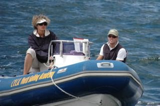 Jenni Bonnitcha on a speed boat, coaching / umpiring.