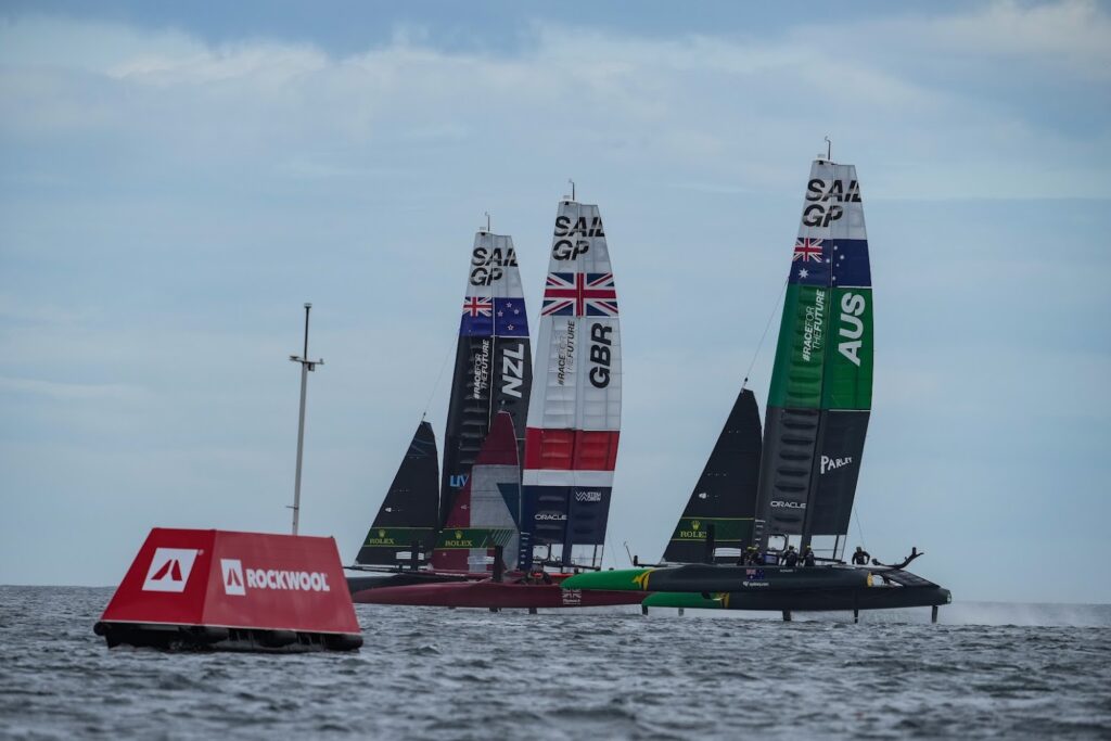 New Zealand SailGP Team helmed by interim skipper Arnaud Psarofaghis, Great Britain SailGP Team helmed by Ben Ainslie and Australia SailGP Team helmed by Tom Slingsby in action during the Practice Fleet Race 4 at Denmark SailGP.