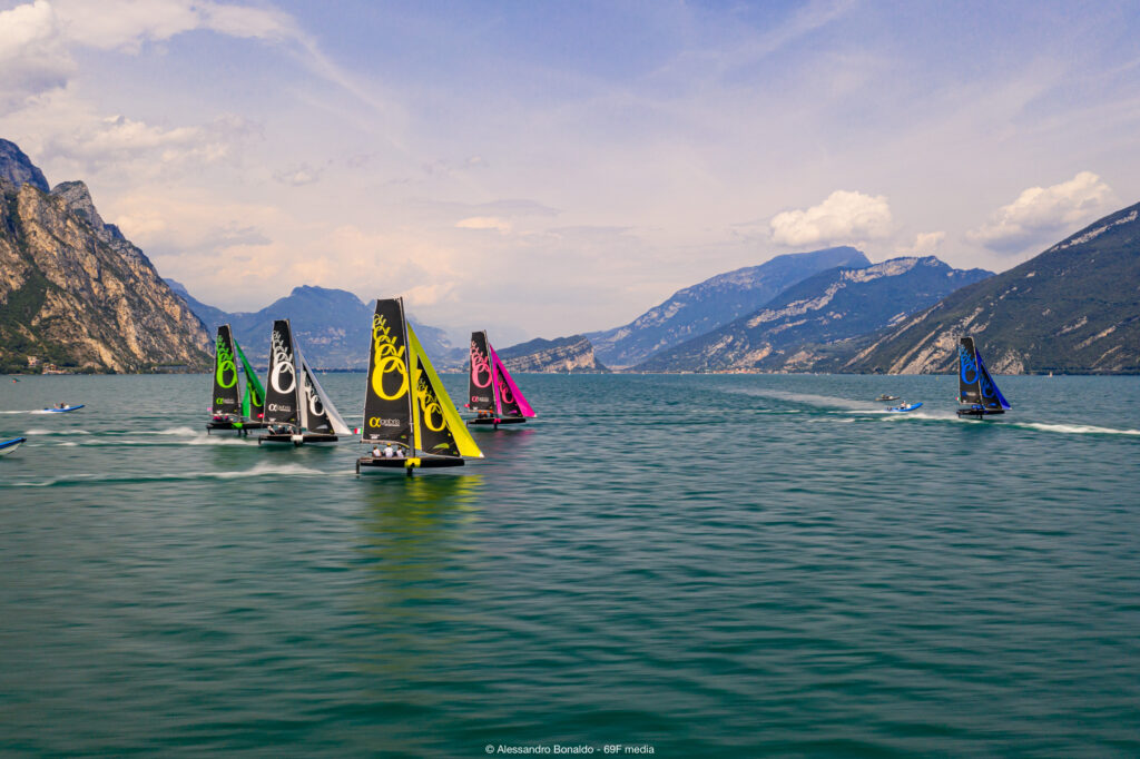 69F boats on a reach, with mountains in the backdrop