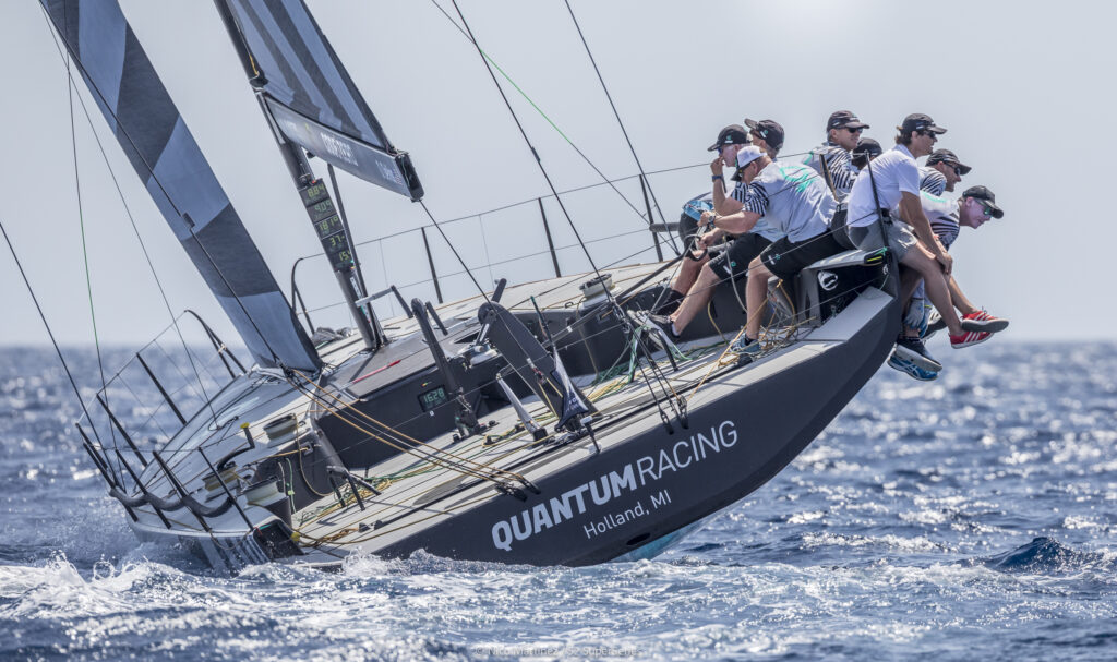 The stern of Quantum Racing sailing upwind.