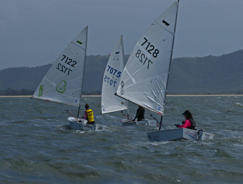 Girls sailing downwind/ 