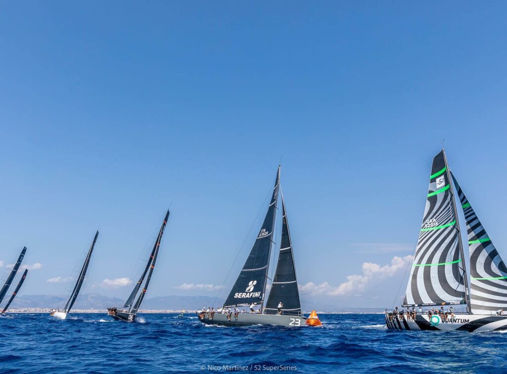 The fleet sailing upwind, led by Quantum Racing.