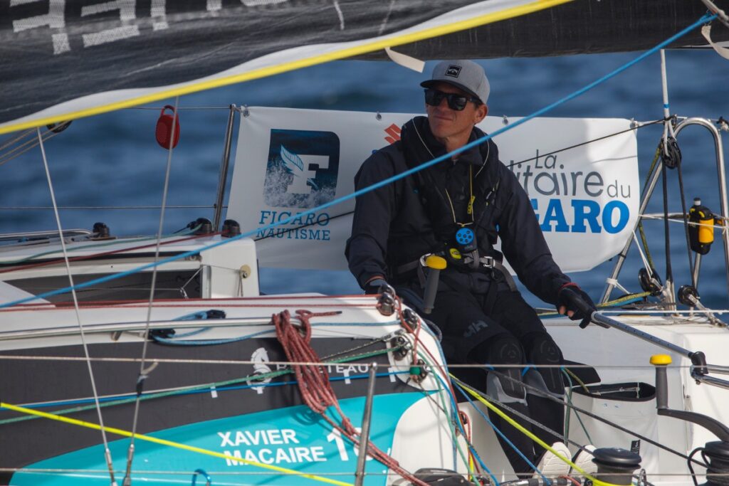 Xavier Macaire steering his boat.