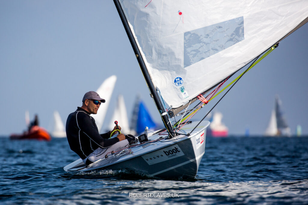 Andre Budzien sailing downwind on flat water.