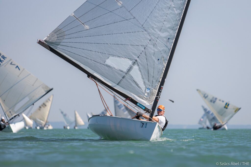 Cees Shueurwater sailing downwind, leaning the boat to windward. 