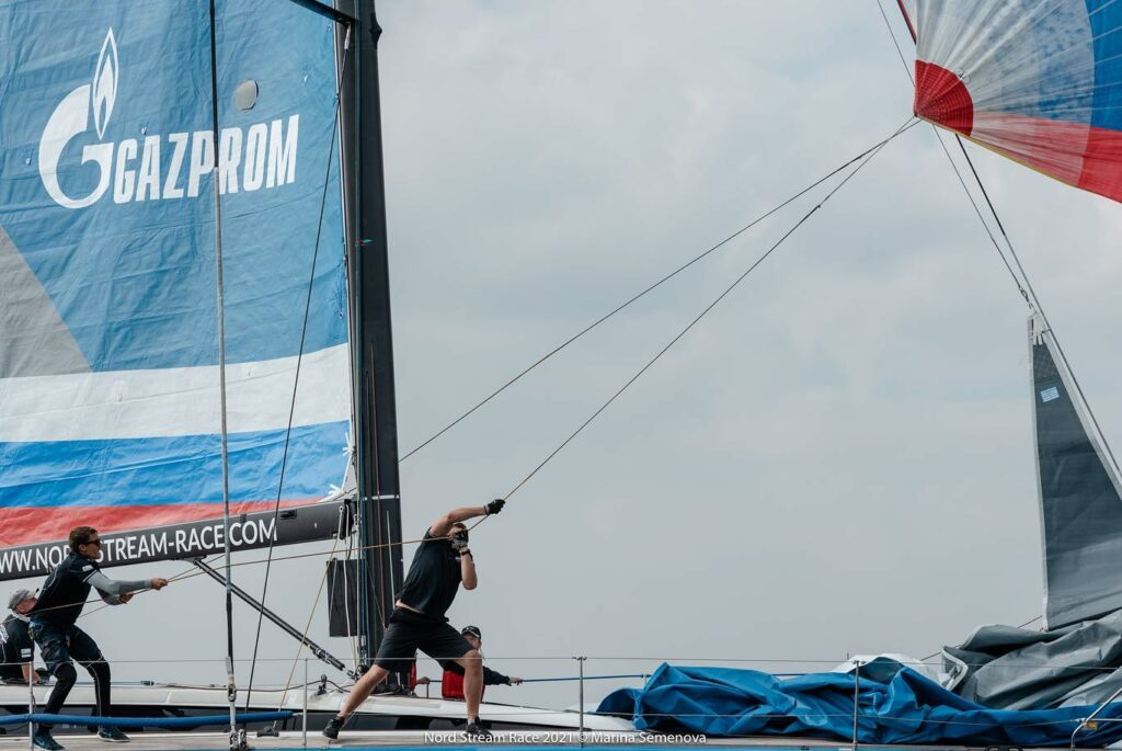 Crew starting to pull the sheet of a kite.