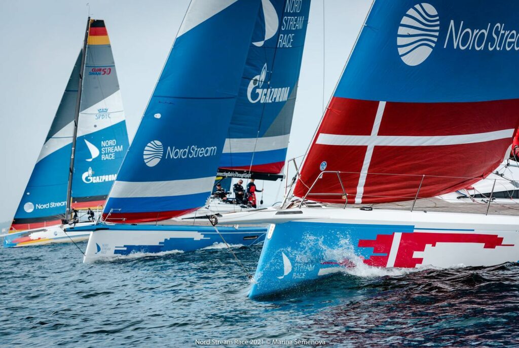 The bows of three boats working upwind.