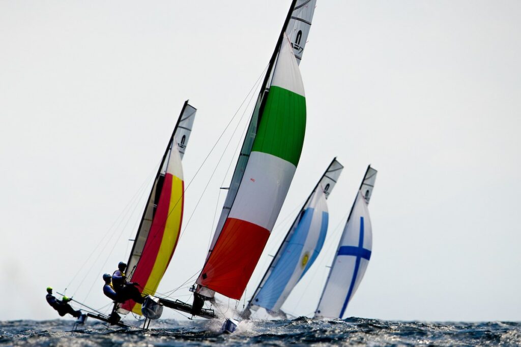 Nacra 17s on a kite run, being led by the Italians.