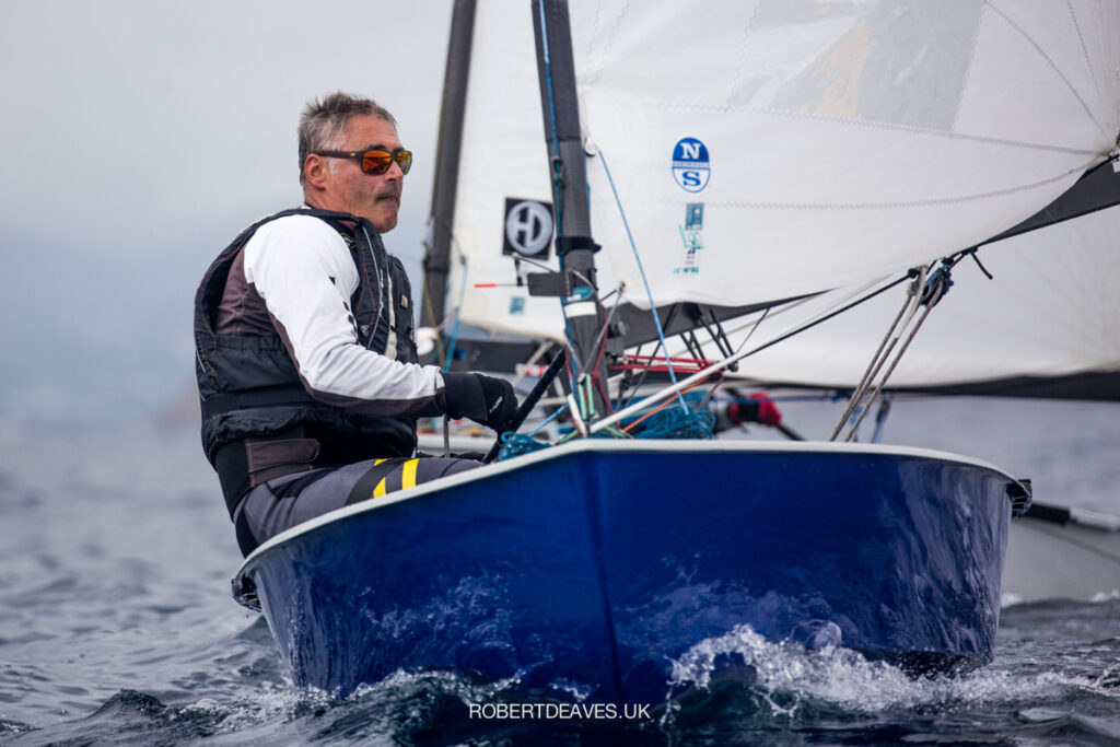 Laurent Hay sailing in his boat (blue hull).