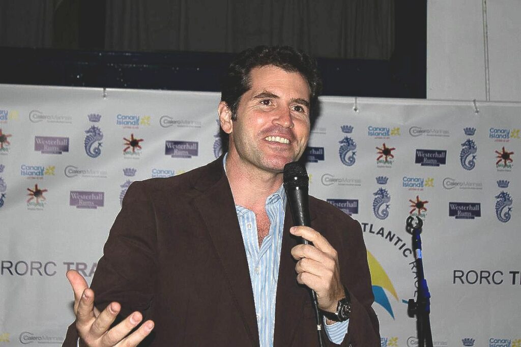 José Juan Calero speaking with a microphone at an event.