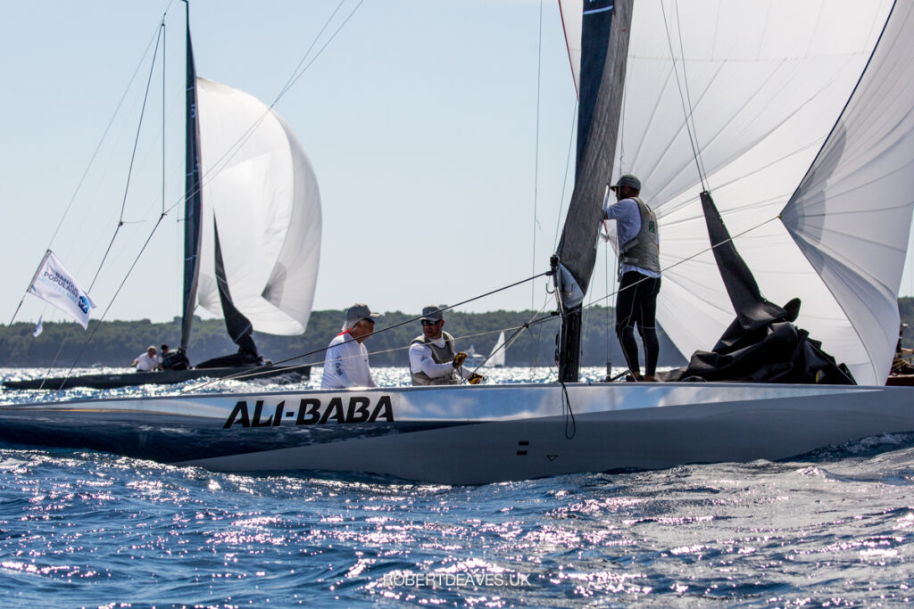 Silver reflective hull of Ali-Baba. They are on a kite run.