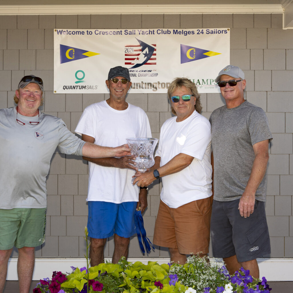 Mike Dow, Bob Clark, Gregg Diehl and James Olsen from Flying Toaster at awards ceremony with trophy.