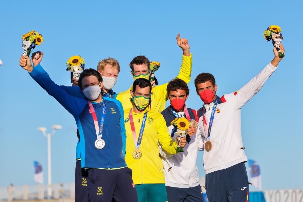 Sweden’s Anton Dahlberg and Fredrik Bergstrom (silver), Mat Belcher and Will Ryan (gold) and Spain's Jordi Xammar and Nicolas Rodriguez Garcia-Paz (bronze) holding their medals at the awards ceremony.