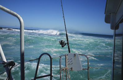 Rough seas from the view of the back of the boat.