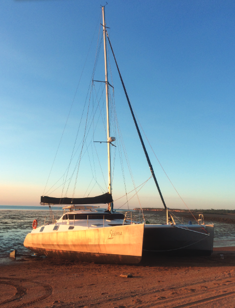 Catamaran beached at sunset