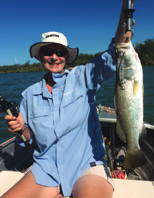 Justine holding a barramundi.