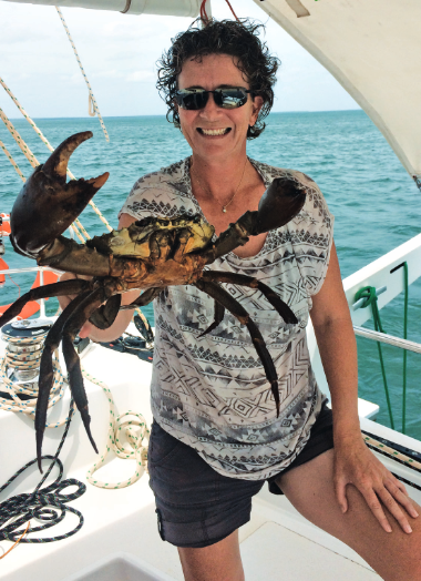 Justine holding a mud crab