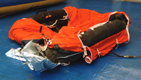 Life raft in the middle of inflating.