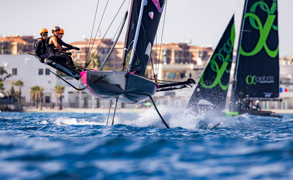 Two boats on different tacks, sailing upwind.