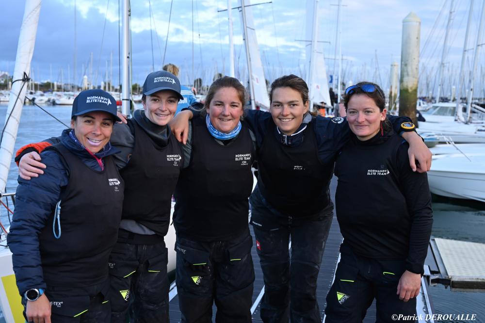 The Match in Pink Team on the dock, smiling.