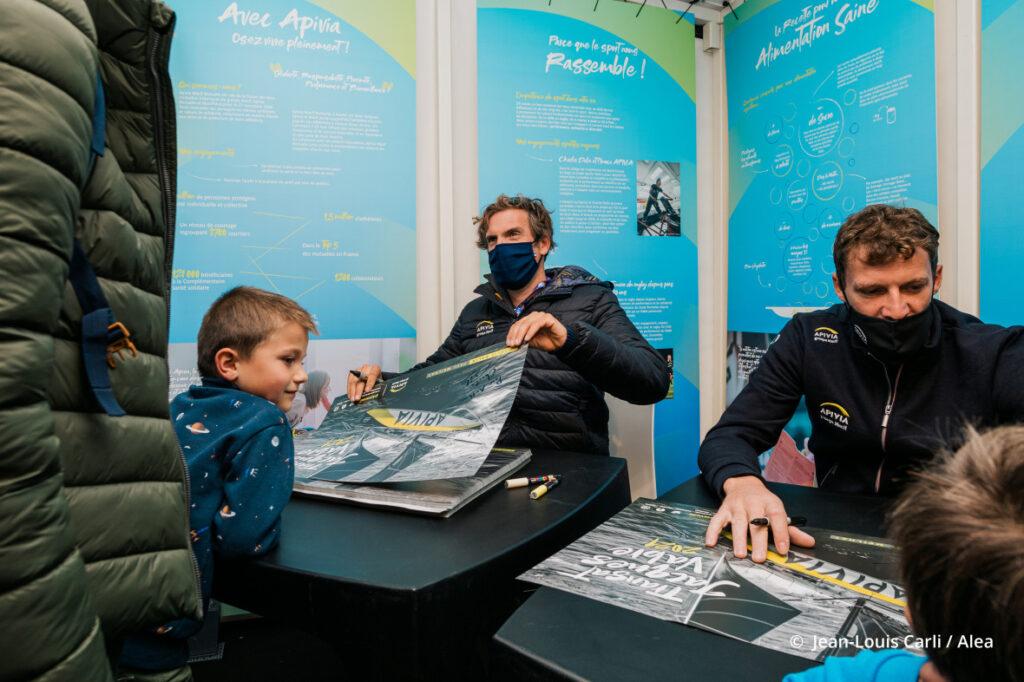 Charlie Dalin and Paul Meilhat signing autographs for kids.