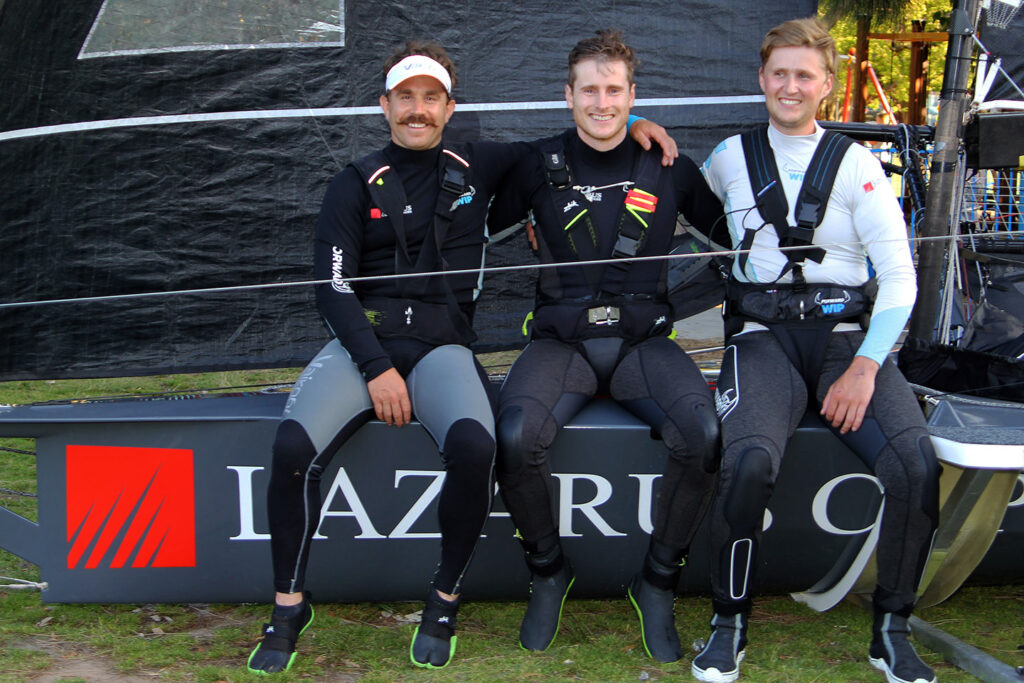 The Lazarus crew sitting on their boat at the boat park.