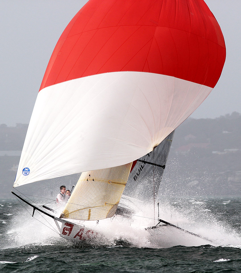 18ft skiff sailing on a kite reach in very windy conditions.