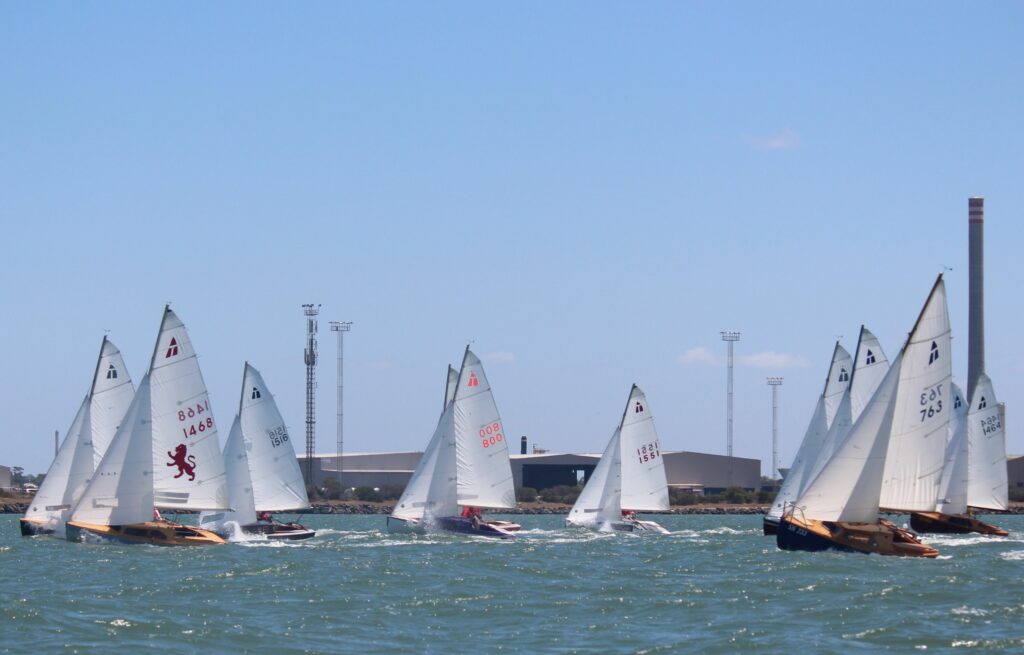 A fleet of Hartley 16’s sailing upwind