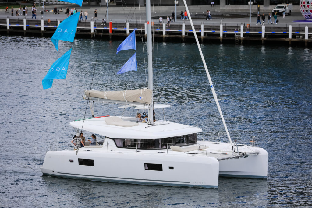 A Lagoon catamaran motoring in Darling Harbour.