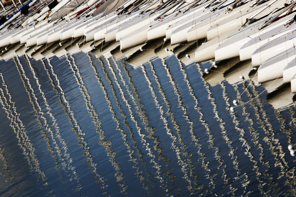 Reflection of masts on the water.