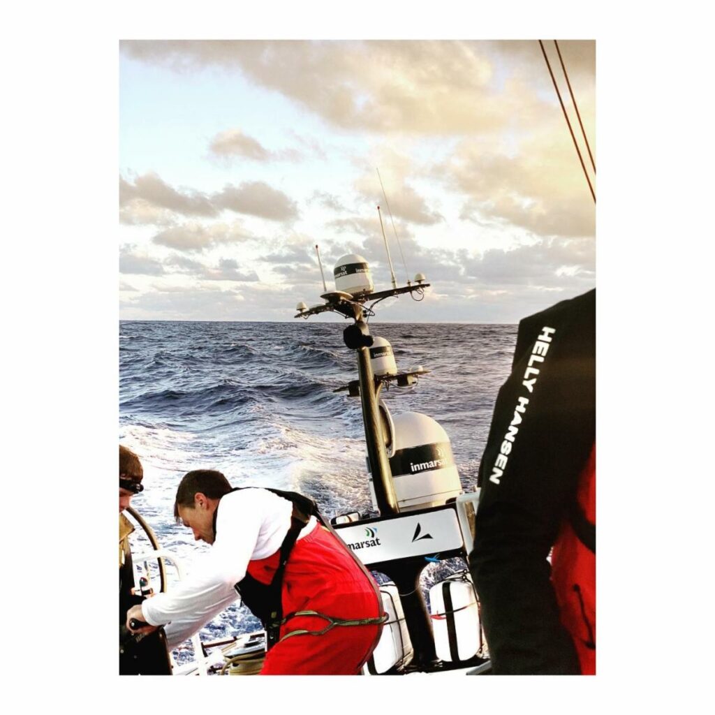 Crew member winding the winch.