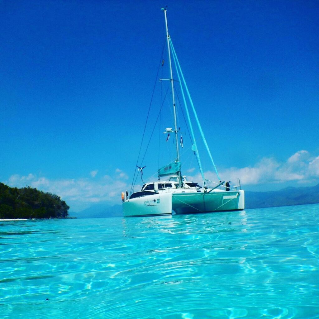 A Lightwave 38 anchored in crystal clear waters.