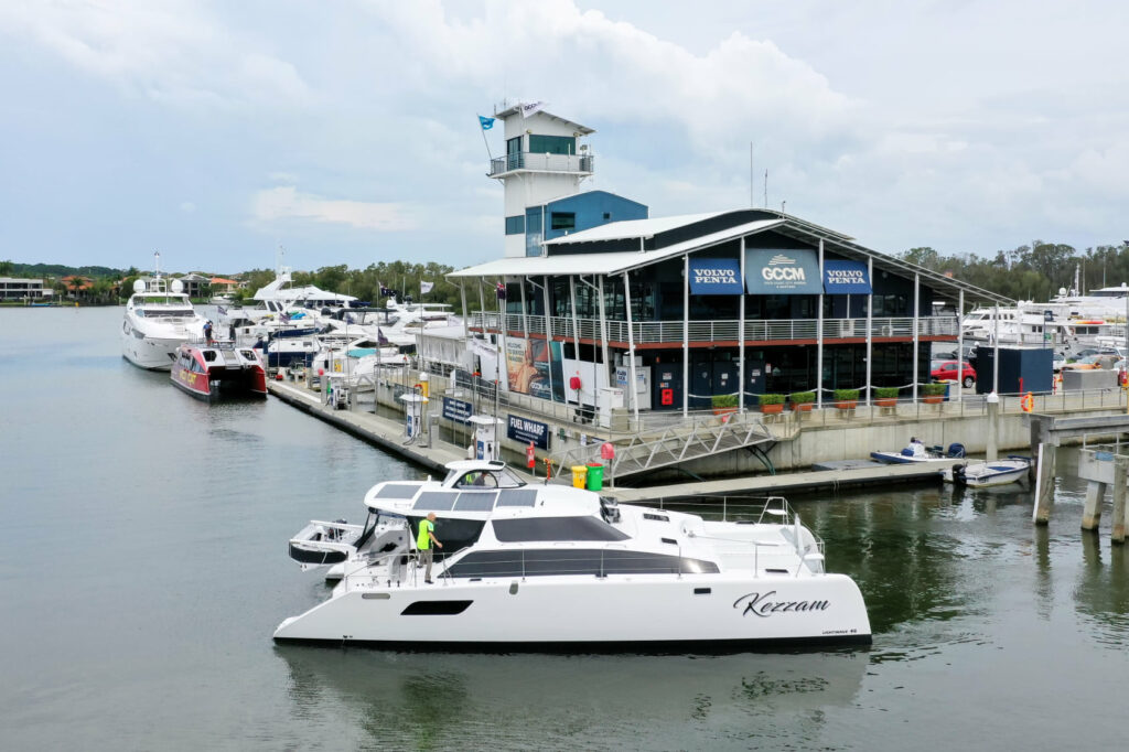 Aerial shot of Kezzam in the water next to the dock.