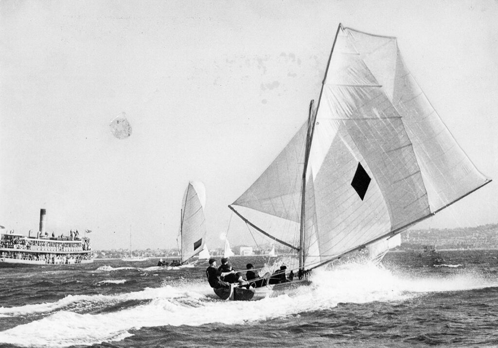 Black and white photo of Aberdare on a rub, other boats in front. Crowded ferry in the background.