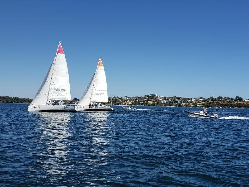 Two boats (windward leeward) sailing upwind.