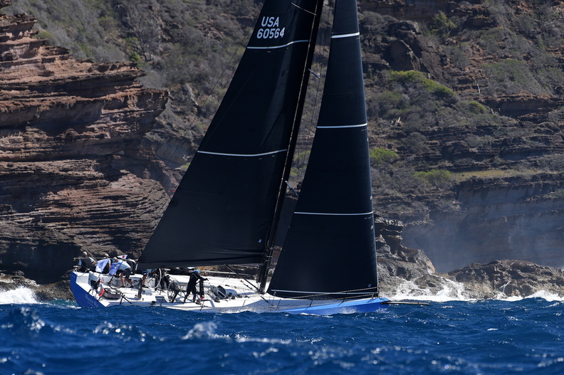 Warrior Won sailing upwind and passing close to land.