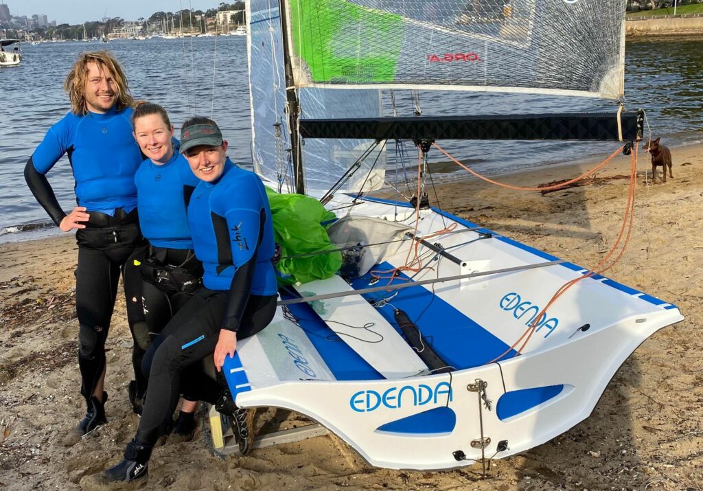 Andrew and Jess Stephenson with Tilly Lang sitting on Edenda on the beach.