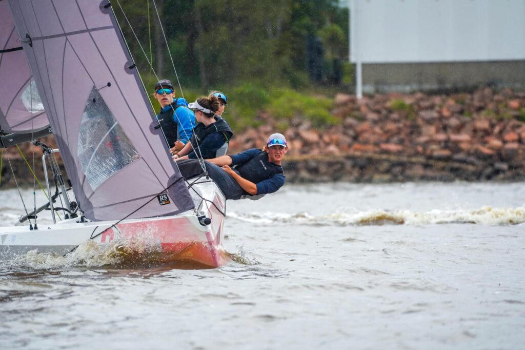 Zac West and his Royal Sydney Yacht Squadron team sailing upwind. Crew hiking hard.