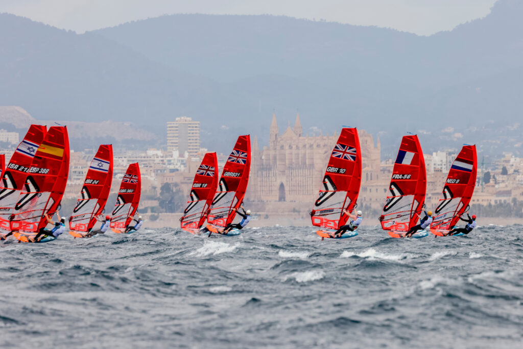 iQFoil fleet sailing upwind.