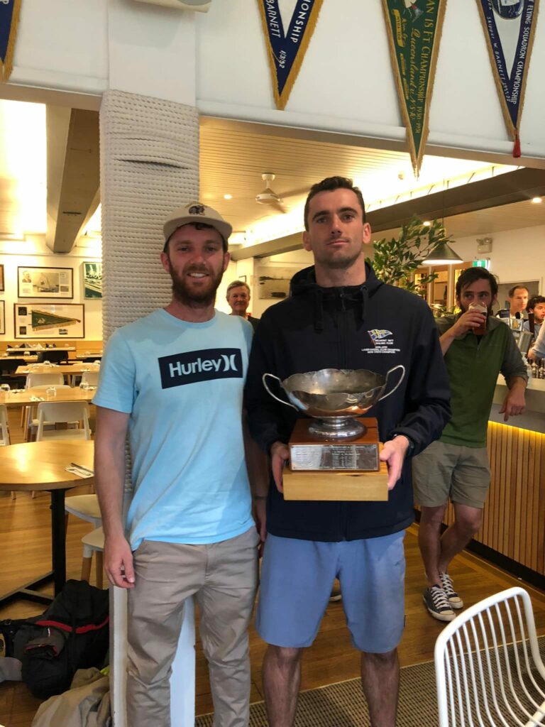 Henry and Jordan Makin holding trophy.