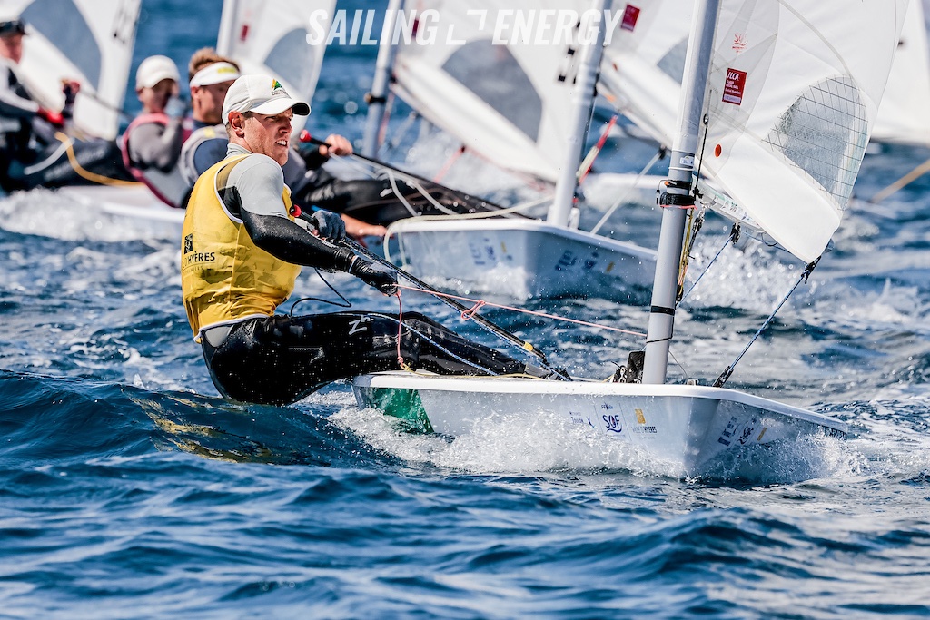 Matt Wearn sailing upwind with fleet behind him.