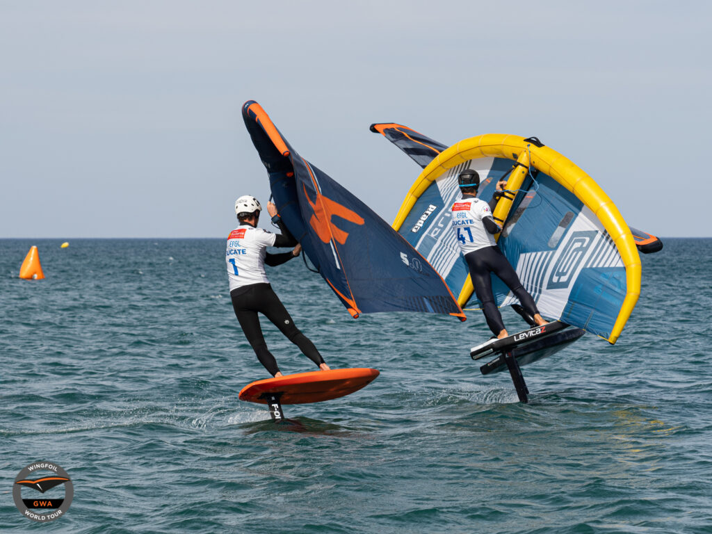 Titouan Galea steals up the inside of Mathis Ghio on a fast downwind gybe. 