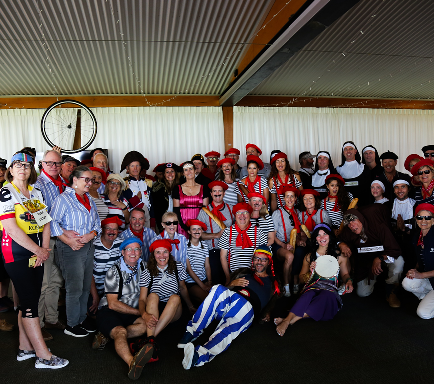 Group photo of people dressed up in typical French gear.