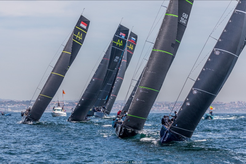 Fleet sailing upwind after race start.