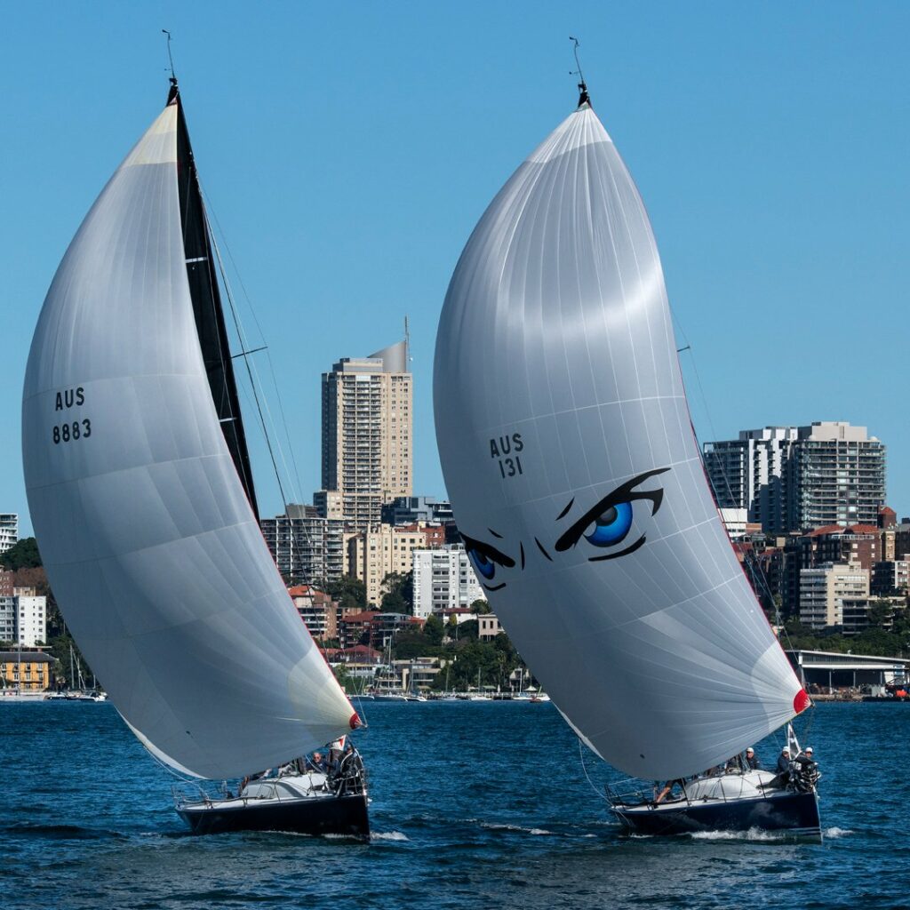 Two yachts sailing on kite reach, windward leeward.