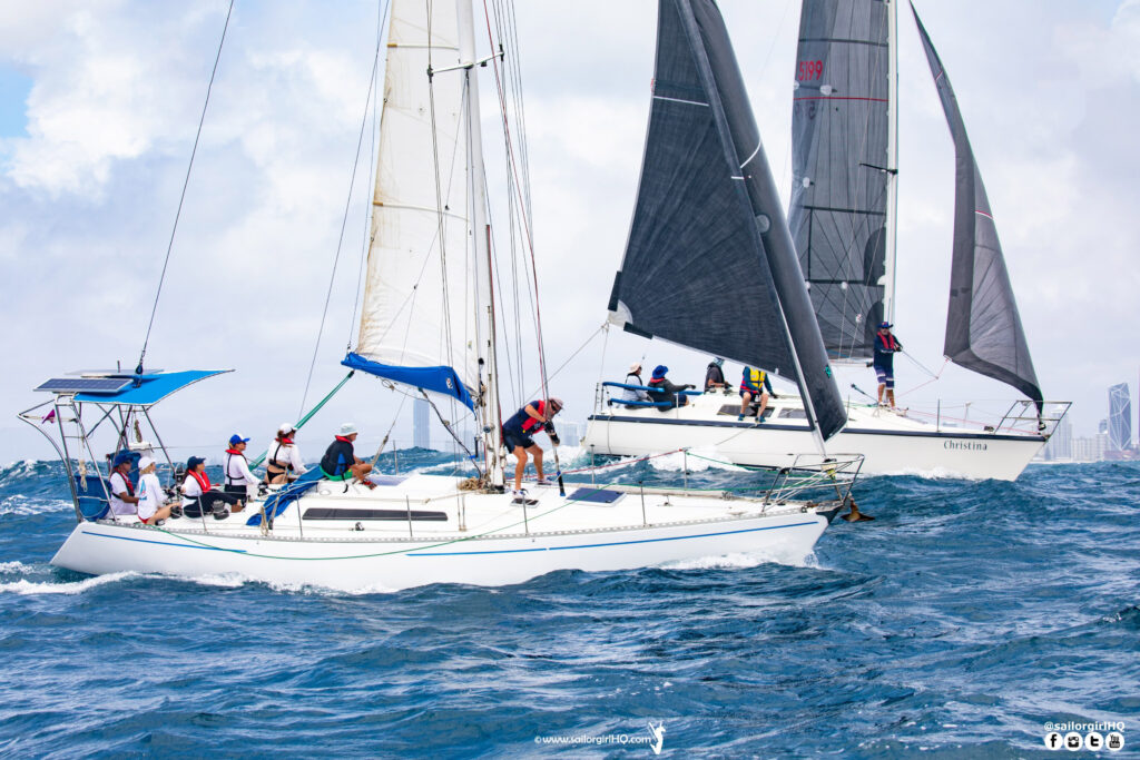 Two boats, windward leeward, on two-sail kite reach.